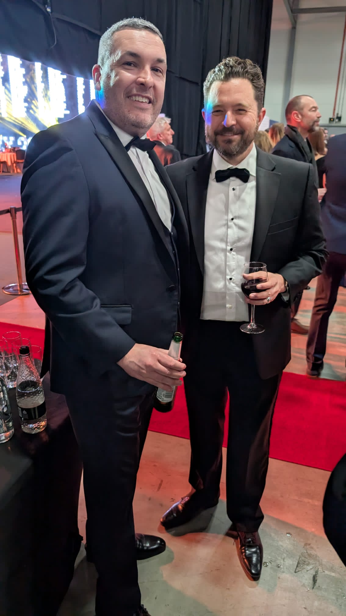 Chris G Jones standing with Daniel Priestley at a business awards evening